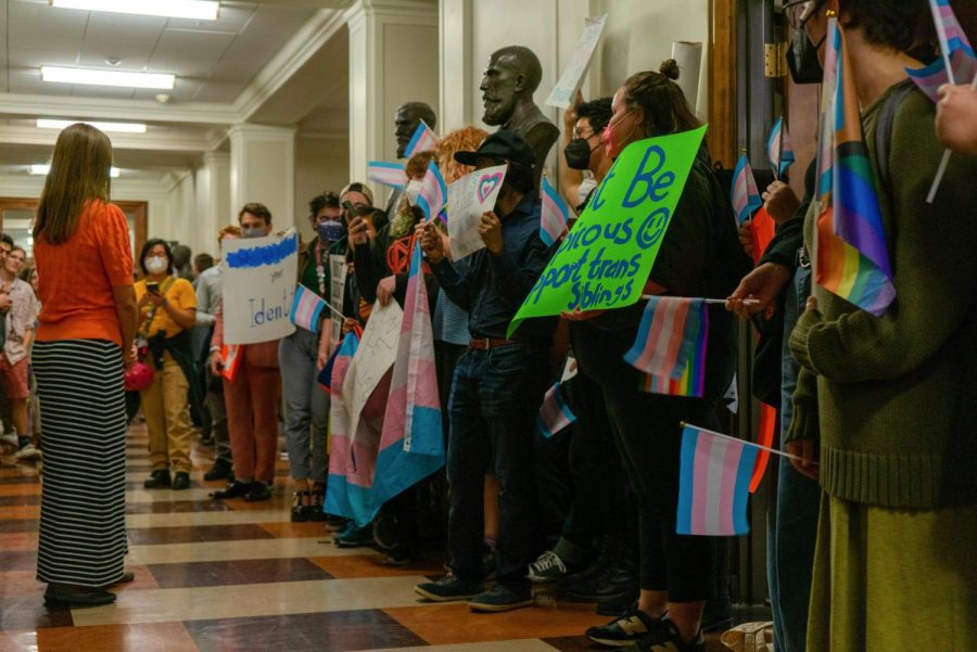 Protesters gather in the halls of Gregory Hall as political commentator Matt Walsh visits campus to speak on Thursday. 