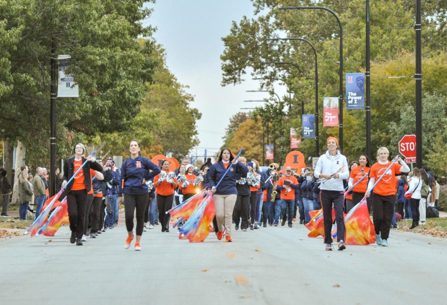 The Marching Illini Alumni band perform at the start of the Homecoming Parade on Friday. 