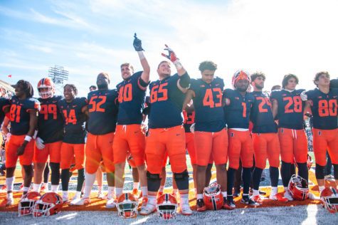 The Illinois football team lines up on the North endzone as they celebrate their Homecoming victory against Minnesota on Saturday.