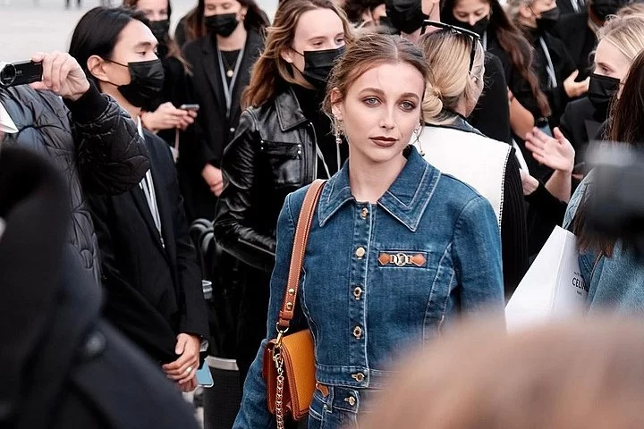 Emma+Chamberlain+at+Paris+Fashion+Week+on+Oct.+5%2C+2021.+Columnist+Matthew+Lozano+argues+that+people+should+not+question+Chamberlains+reliability+based+on+how+her+rise+to+fame.+