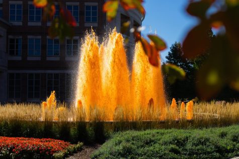 The Alice Campbell Alumni Center fountain is dyed orange for the Homecoming Kickoff on Oct. 9.
