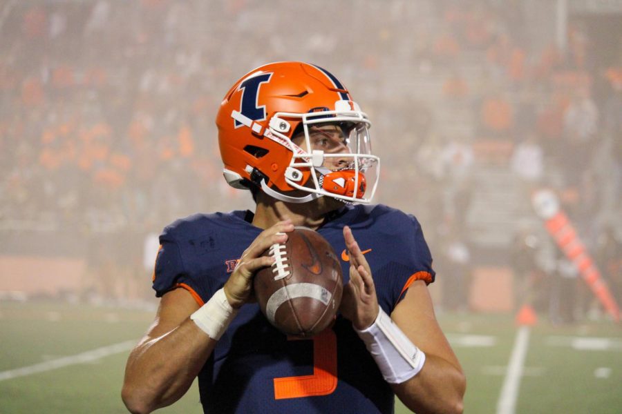 Illinois quarterback Tommy DeVito warms up before game at Memorial Stadium.