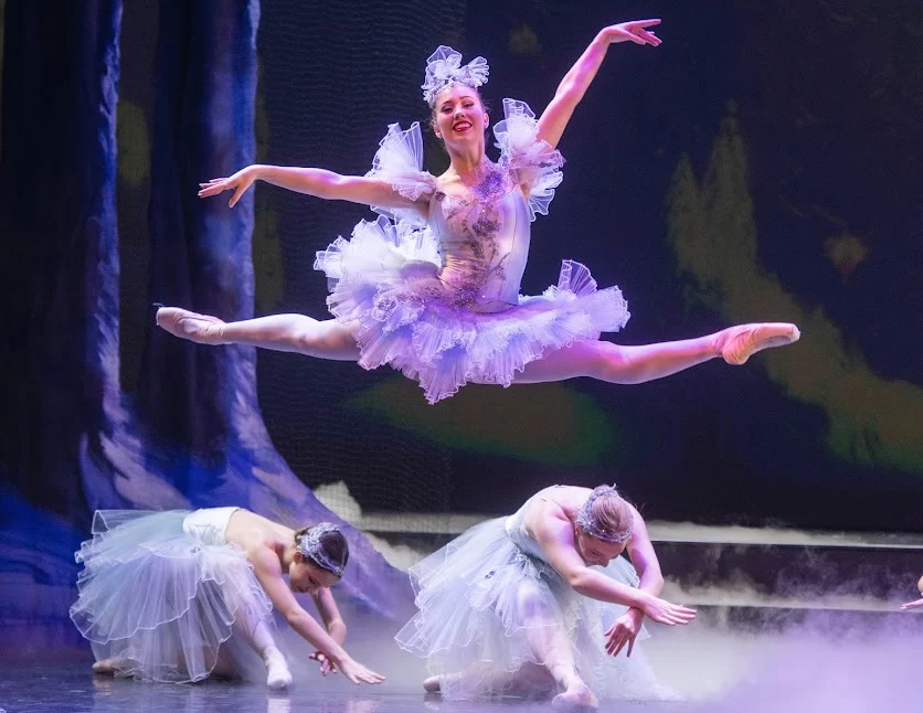 Prima Ballerina Lauren Frost leaps above her fellow ballerinas during a ballet performance for C-U Ballet. Frost has recently made a career change in accepting a position of patrol deputy at Champaign County Sheriff’s Department. 