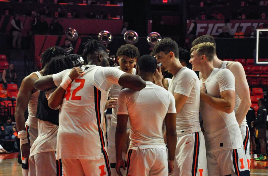 The+Illinois+mens+basketball+team+huddle+before+the+game+against+Quincy+on+Oct.+28.+