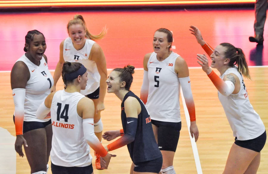 The+Illinois+volleyball+team+cheer+on+the+court+during+their+match+up+against+Minnesota+on+Nov.+6.+