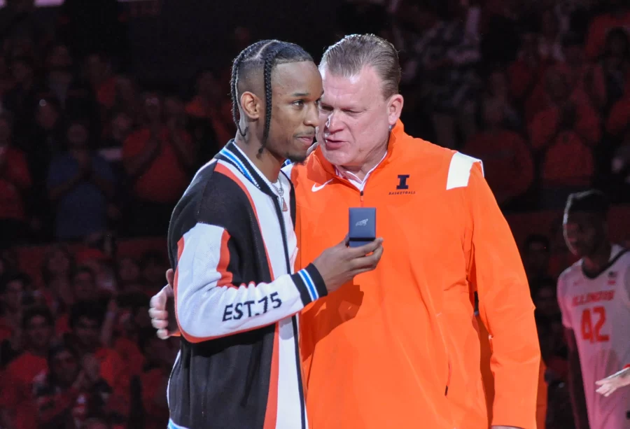 Former Illinois mens basketball guard Trent Frazier receives his 2022 Big Ten Championship ring from Illinois head coach Brad Underwood during the ring and banner ceremony on Friday. 