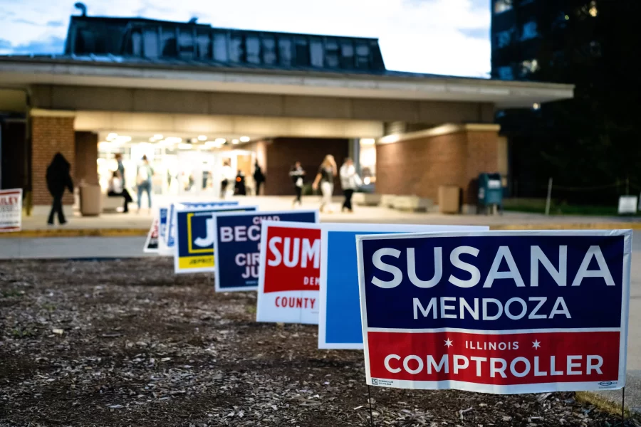 Political campaign signs placed outside of the entrance of FAR, the least-crowded polling location, on Nov. 8.
 
