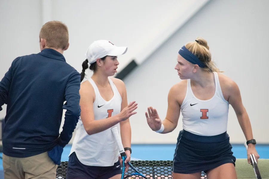 Junior Katie Duong (left) and sophomore Megan Heuser (right) head back out onto the court during their match against Indiana on Feb. 5. 