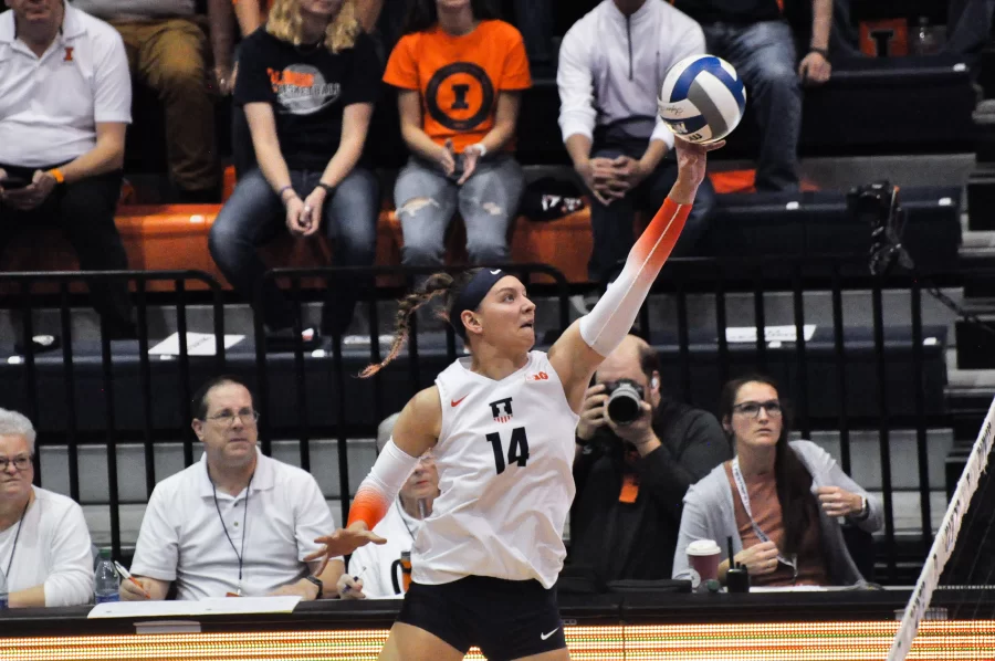Senior outside hitter Jessica Nunge hits the ball over the net during the third set against No. 9 Minnesota on Sunday. 