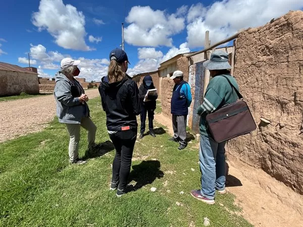 Ann-Perry Witmer (left), professor and senior research scientist, visits residents of Janko Kollo with FIEA engineer Xiomara Echeverria to learn more about indigenous practices and community technical needs. 