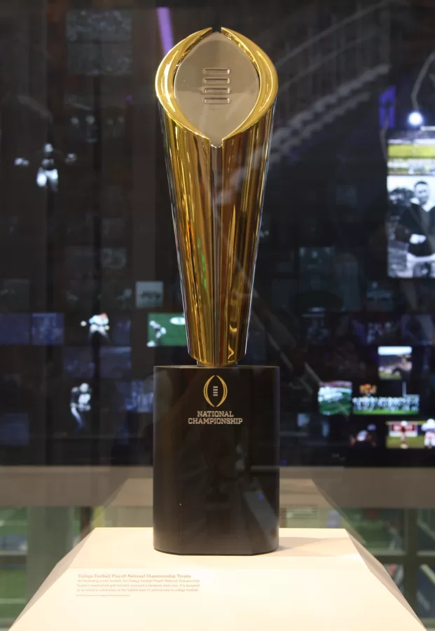 The College Football Playoff National Championship Trophy on display at the College Football Hall of Fame on Aug. 31, 2017. Columnist Dan Kibler argues that people should put more emphasis on bowl games rather than the College Football Playoffs.