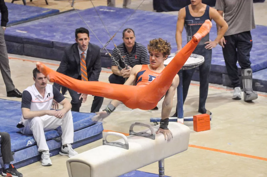 Junior all-around Ethan Boder performs on the pommel horse during the Orange and Blue meet on Friday. 