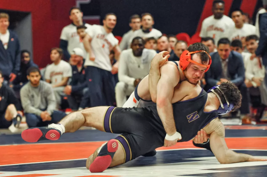 Redshirt+junior+Danny+Braunagel+takes+down+Northwestern+on+Jan.+29.+The+Illini+will+be+having+their+first+home+meets+for+the+regular+season+on+Saturday.+
