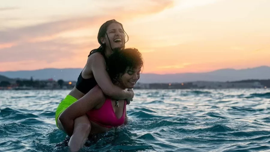 Manal Issa and Nathalie Issa laughing and smiling in the show The Swimmers.
November 2022 Netflix release show The Swimmers is a biograph focused and based off the journey of 2016 Olympics athletes and sisters Sara and Yursa Mardini.