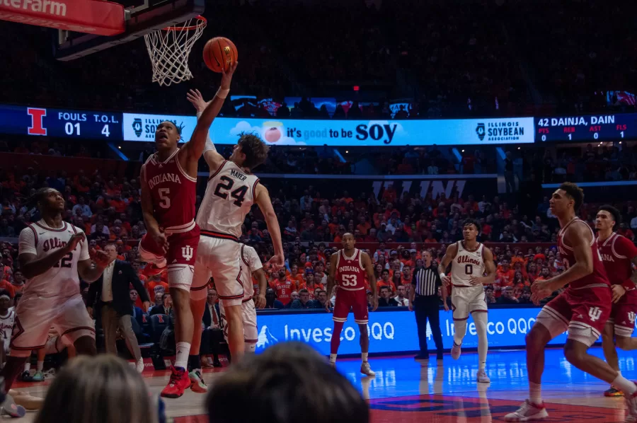 Fifth-year forward Matthew Mayer attempts to block a layup from Indianas Malik Reneau on Jan. 19. Mayer had a solid performance on Saturday against Wisconsin, helping to lead the Illini to a 61-51 win.