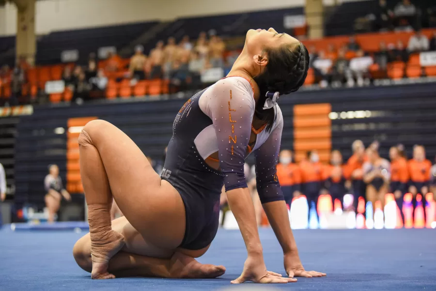 Senior Mia Takekawa poses at a meet against Rutgers on Feb. 25, 2022. On Saturday, Takekawa finished with a 9.950 on beam, placing first.