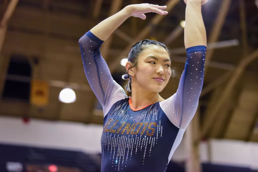 Senior Mia Takekawa poses at a meet against Rutgers on Feb. 25, 2022. On Saturday, Takekawa finished with a 9.950 on beam, placing first.