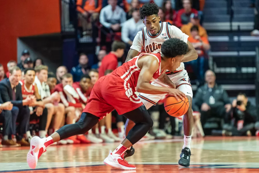 Guard+Sencire+Harris+guards+off+the+opposing+team+on+Jan.+7%2C+during+a+match+against+Wisconsin.+Despite+being+a+terrific+guard+for+the+Illini+Harris+still+needs+to+work+on+his+shooting+as+seen+during+Tuesdays+game+against+Nebraska.%0A
