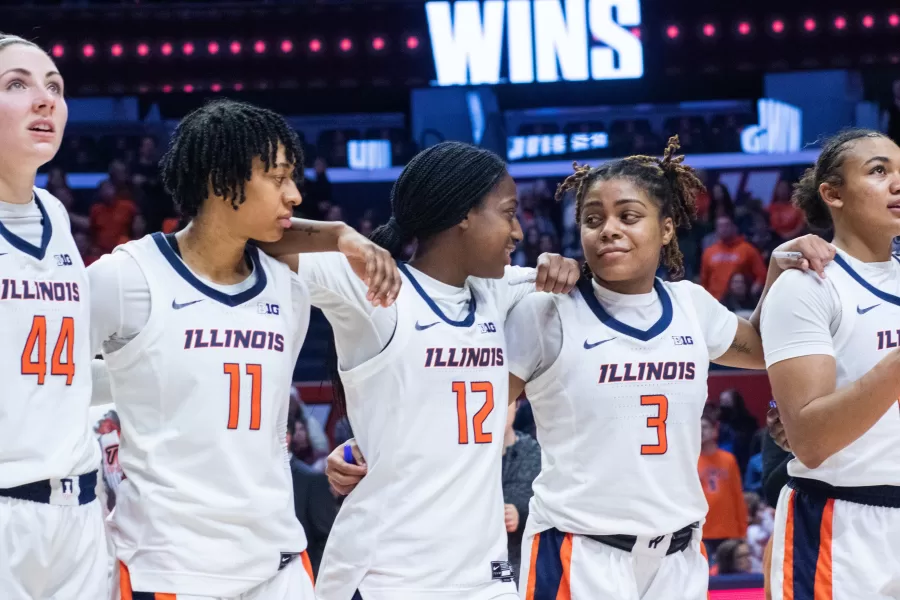 Players+of+the+Illinois+womens+basketball+team+line+up+after+the+game+on+Sunday+against+Michigan+State+to+sing+Hail+to+the+Orange.+After+a+back+and+forth+game%2C+the+Illini+came+out+on+top+with+86+points+to+the+Spartans+76.