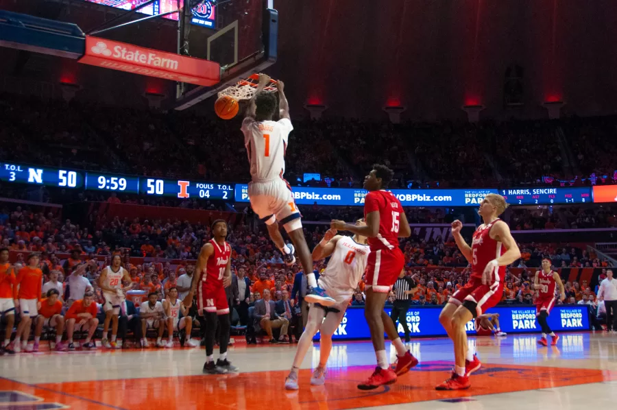 Freshman guard Sencire Harris dunks during the second half against Nebraska on Tuesday. The dunk, made with help from Terrence Shannon Jr., helped the Illini to pull ahead, making the score 52-50.