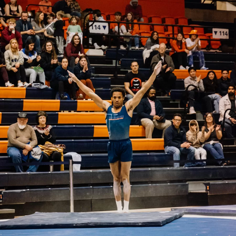 Sophomore Amari Sewell sticks his landing during his floor routine at the Orange and Blue Meet on Dec. 9.