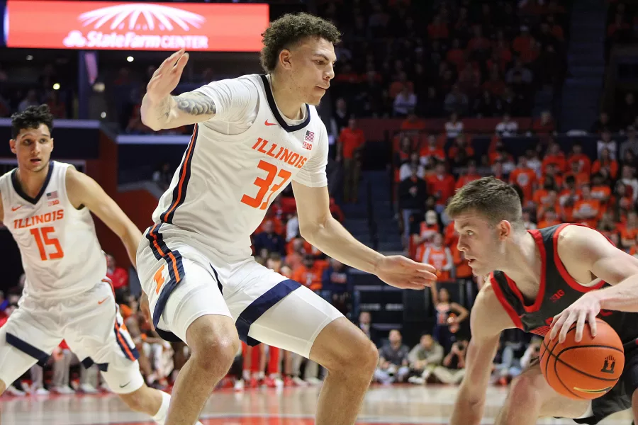Junior+forward+Coleman+Hawkins+defends+against+Ohio+State+on+Tuesday.+Hawkins+had+solid+offense+during+the+game%2C+helping+to+secure+a+win+for+the+Illini