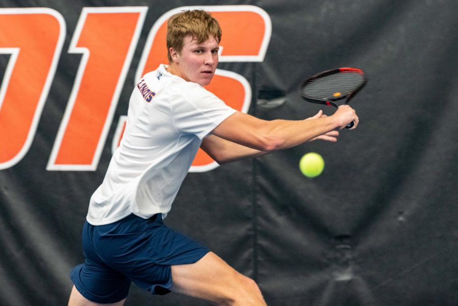 Sophomore Karlis Ozolins hits a backhand during a match against the University of Central Florida. Ozolins had a strong performance and won his second set during singles against one of the top-ranked players in the nation.