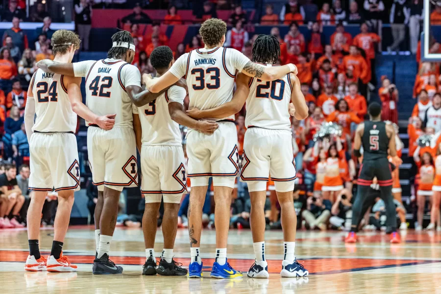 Players line up at the center of the court following a technical foul by junior forward Coleman Hawkins for hanging on the rim during the game against Rutgers on Saturday.