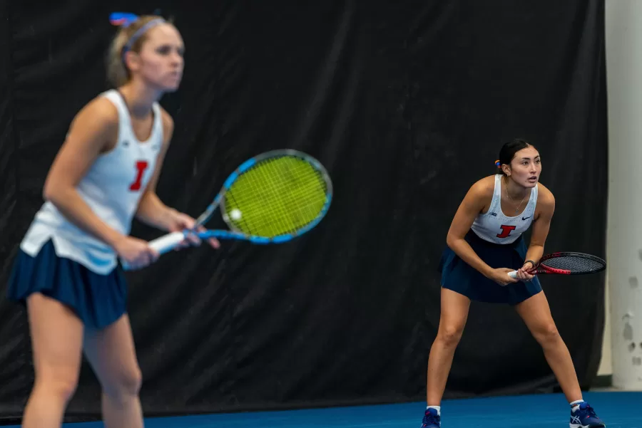 Sophomores Kida Ferrari and Kasia Treiber prepare for a serve during a doubles match against 
Illinois State on Sunday. The duo won their match, despite falling behind early on. 