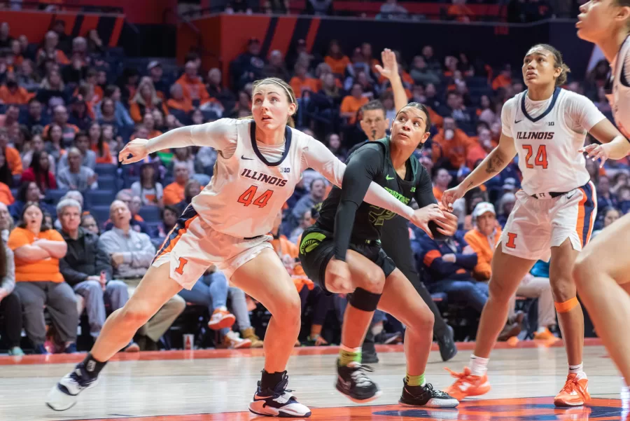 Junior+forward+Kendall+Bostic+putting+herself+in+front+of+the+ball+after+a+Michigan+state+free+throw+on+Jan.+23.+Bostic+and+guard+Genesis+Bryant+carried+in+points+for+the+Illini+during+Thursdays+game+against+Michigan+however+the+Illini+were+unable+to+secure+the+win.
