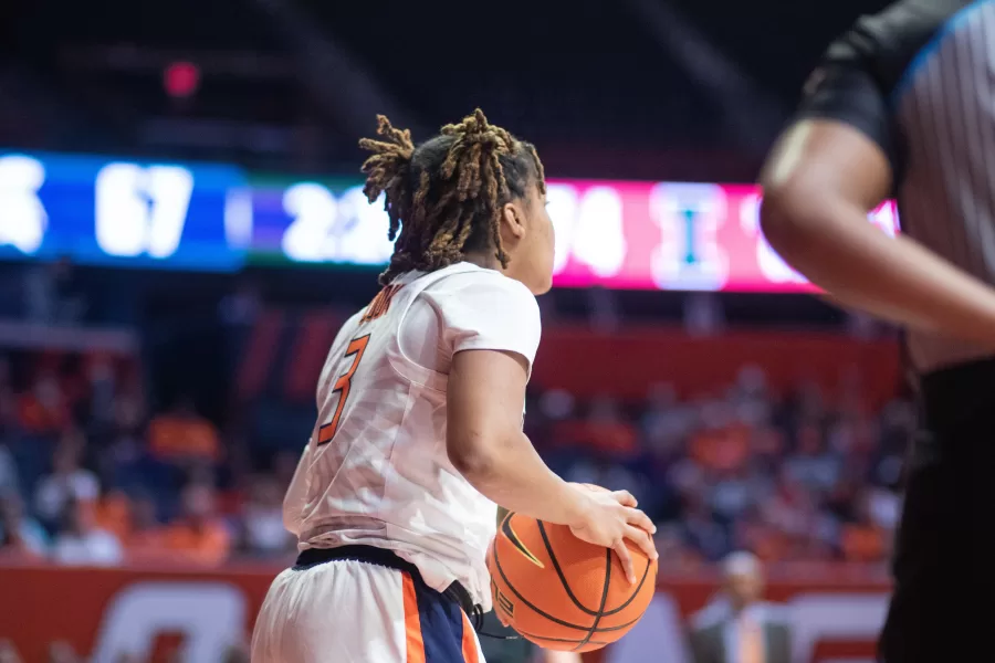Junior guard Makira Cook looks for a teammate to pass to against Michigan State on Jan. 29. Cook combined with junior guard Genesis Bryant to score 38 points on Sunday against Minnesota, leading to an Illini victory.