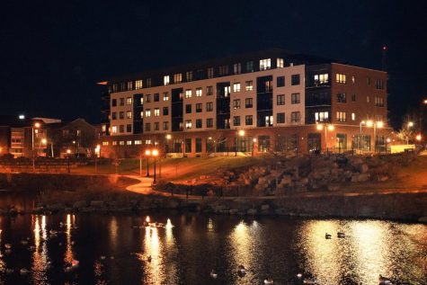 Evening view on Sunday of the Midtown Plaza apartment building alongside Boneyard Creek. Columnist Daniel Kibler writes on the benefits of off-campus living as compared to university living.   