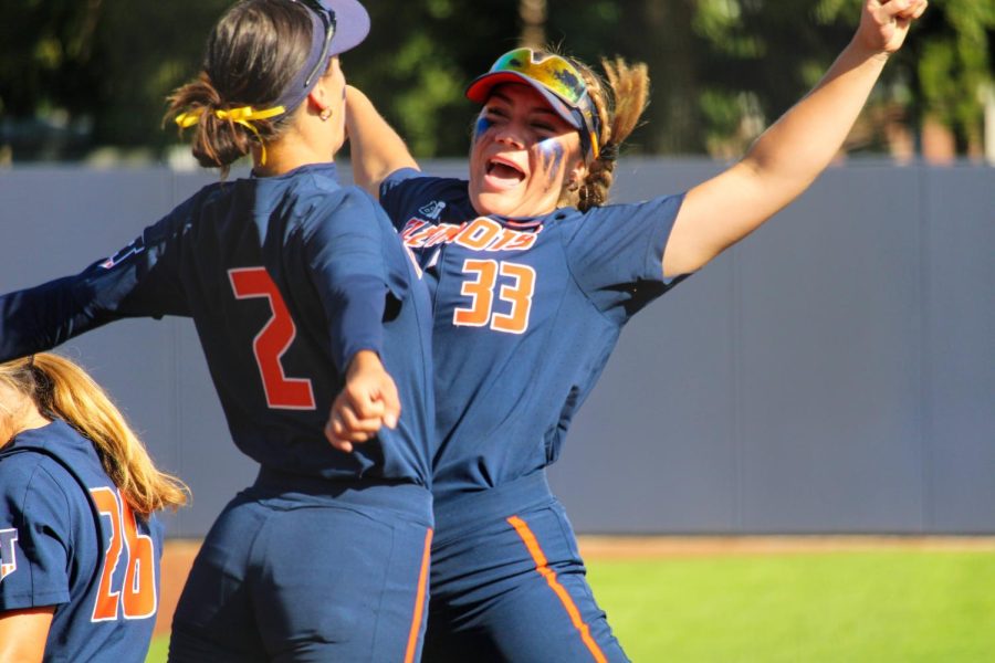 Senior utility Gabi Robles and redshirt freshman utility Yazzy Avila celebrate with a chest bump during a game against Lakeland on Sept. 24. On Wednesday, the Illini secured a 5-1 win against the Braves of Bradley University.