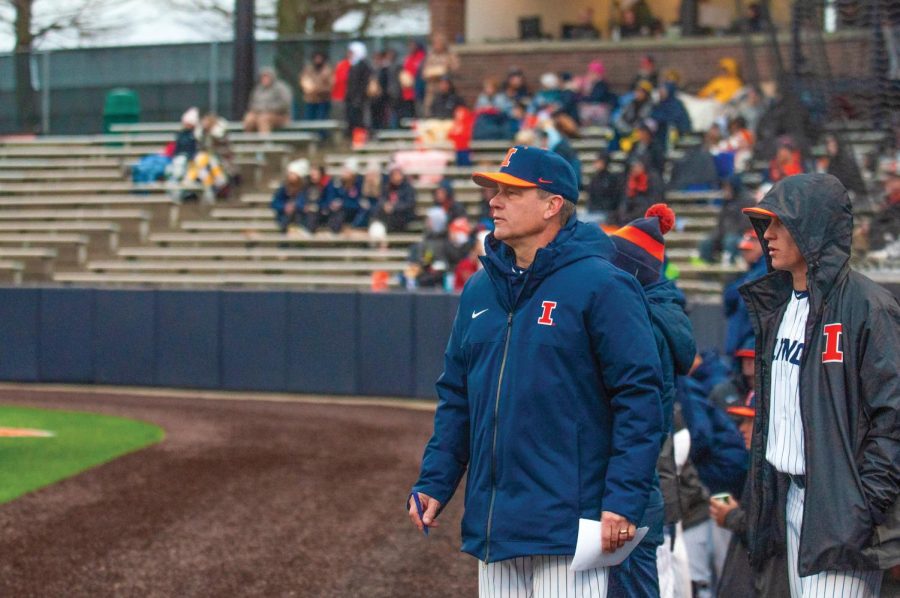 Head baseball coach Dan Hartleb leaves the dugout to walk to the bullpen in the middle of the fourth inning during the game against Michigan on Saturday, Apr. 1. Hartleb broke the program record for wins (519) the following day.