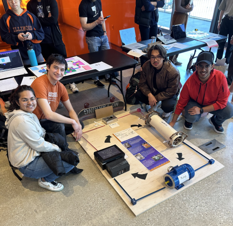 ME 200 students John Bradwell, Fele Felemban, Vansh Goel and Vaani Chimnani pose next to their project The Abbott Rankine Cycle.