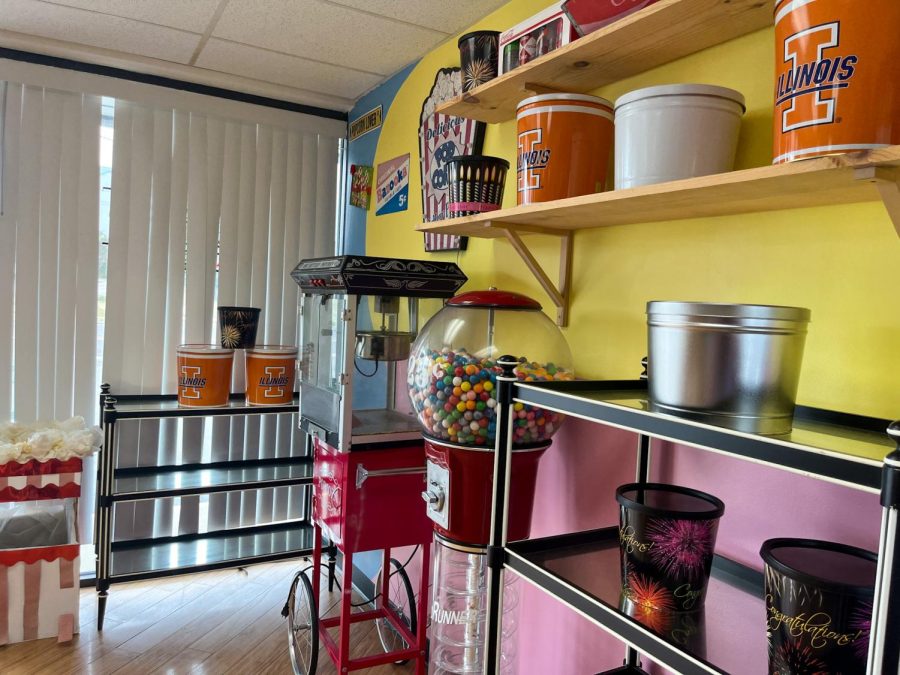 The back corner of CBPB, which features an antique popcorn machine and several tins available for purchase to customers.