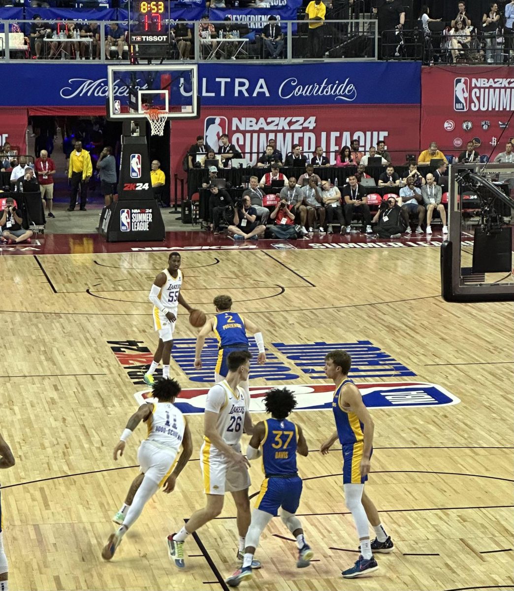 Member of the 2021-22 Illinois mens basketball team Brandin Podziemski guards at center court for the Golden State Warriors.