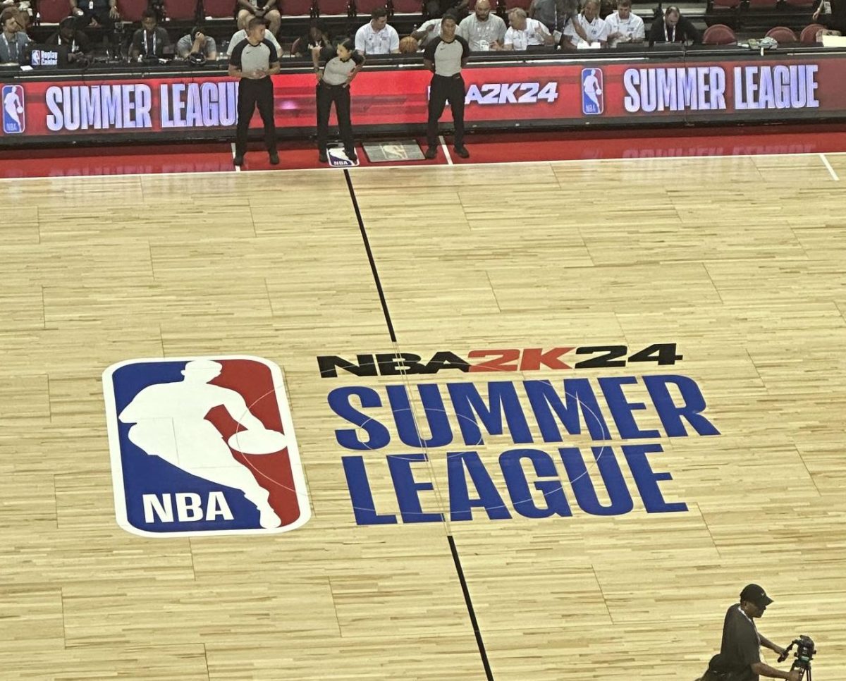 Mid-court logo depicting the NBA 2K24 Summer League logo inside of Thomas and Mack Center.