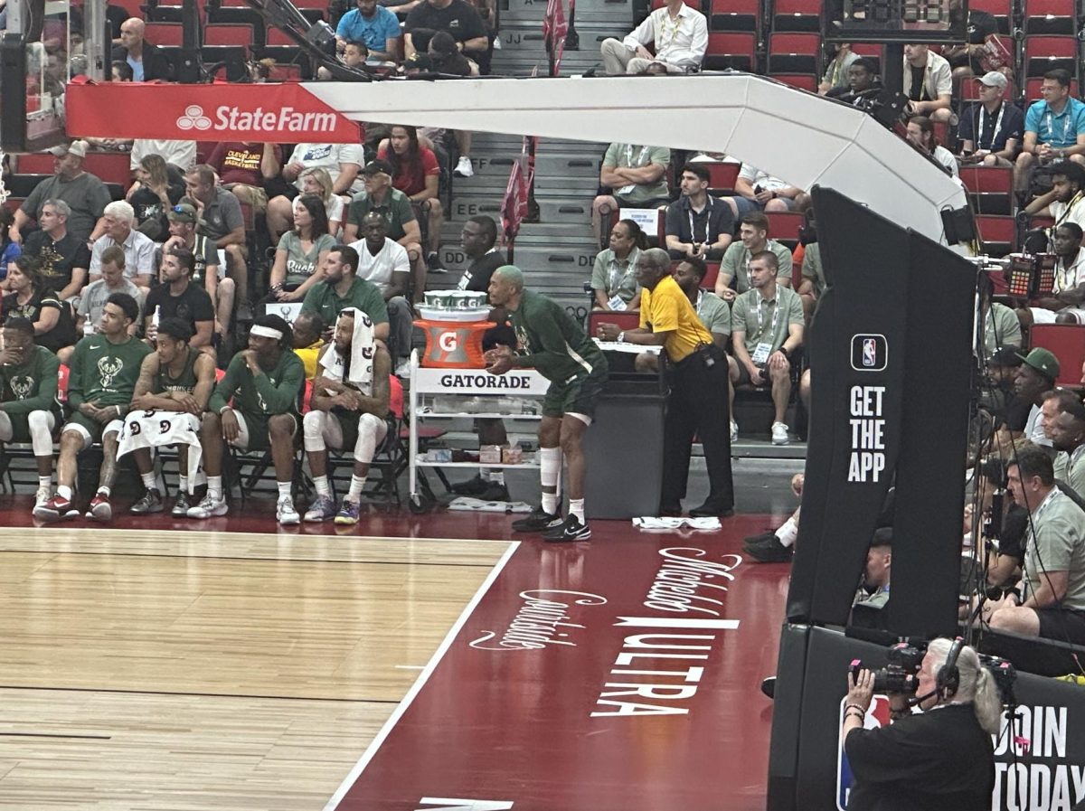 Alan Griffin, member of Illinois basketball from 2018-2020, cheers on the Milwaukee Bucks from the sidelines in their eventual 84-75 win over the Phoenix Suns. Through two contests, the Bucks are undefeated but Griffin has not been given any minutes. 