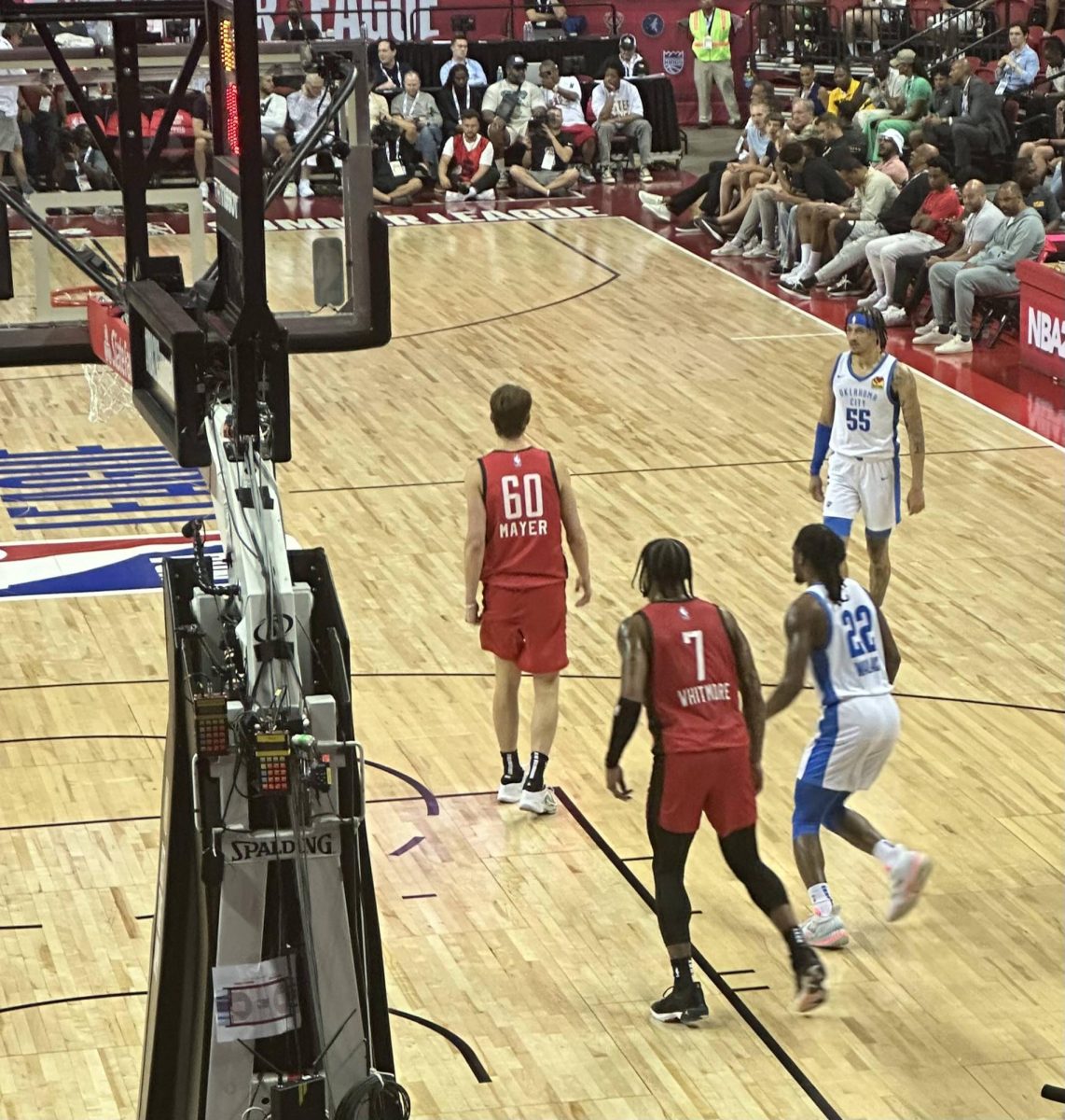 One-year Illini Matthew Mayer on the floor for his NBA 2K24 Summer League debut against the Oklahoma City Thunder. Mayer has contributed to three of Houstons five wins and will play a big role in the championship game on Monday.