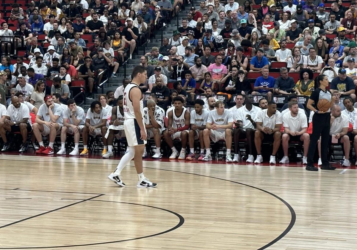 After making his NBA 2K24 Summer League debut, former Illini Mark Smith (13) awaits his return during the second quarter of the Denver Nuggets contest with the Atlanta Hawks.