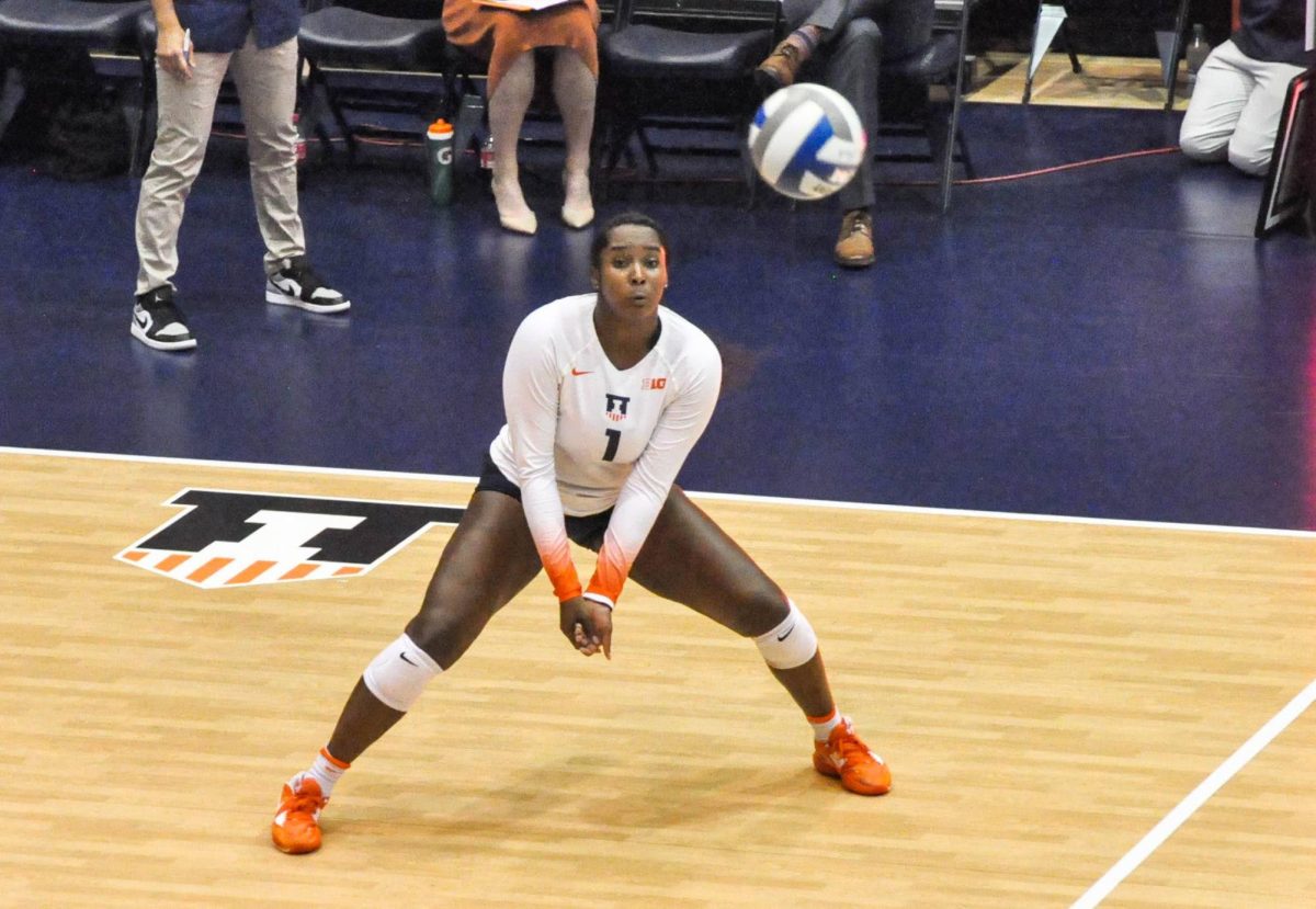 Middle+blocker+Kennedy+Collins+in+position+to+volley+the+ball+against+Maryland+on+Sept.+23%2C+2022.+The+Illini+suffered+a+defeat+from+Notre+Dame+and+Oklahoma+on+Thursday+and+Friday.+