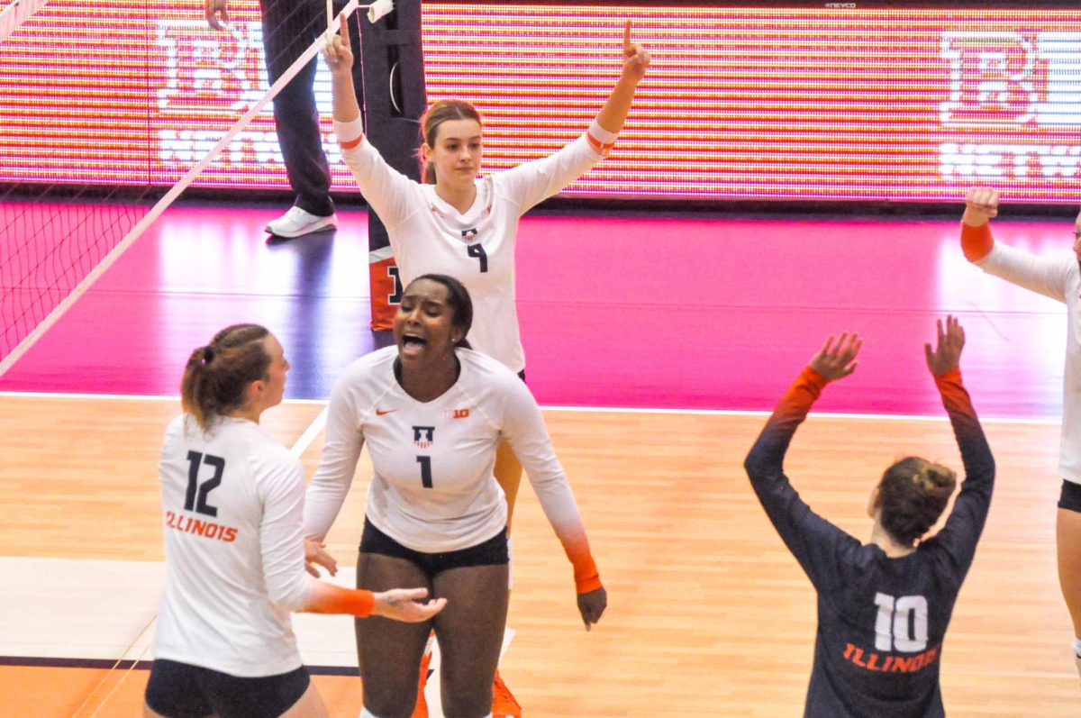 The+Illini+share+some+team+energy+amongst+themselves+on+Sept.+23%2C+2022+against+Marlyand.+The+Illini+will+face+Notre+Dame+and+Oklahoma+in+their+upcoming+matches.