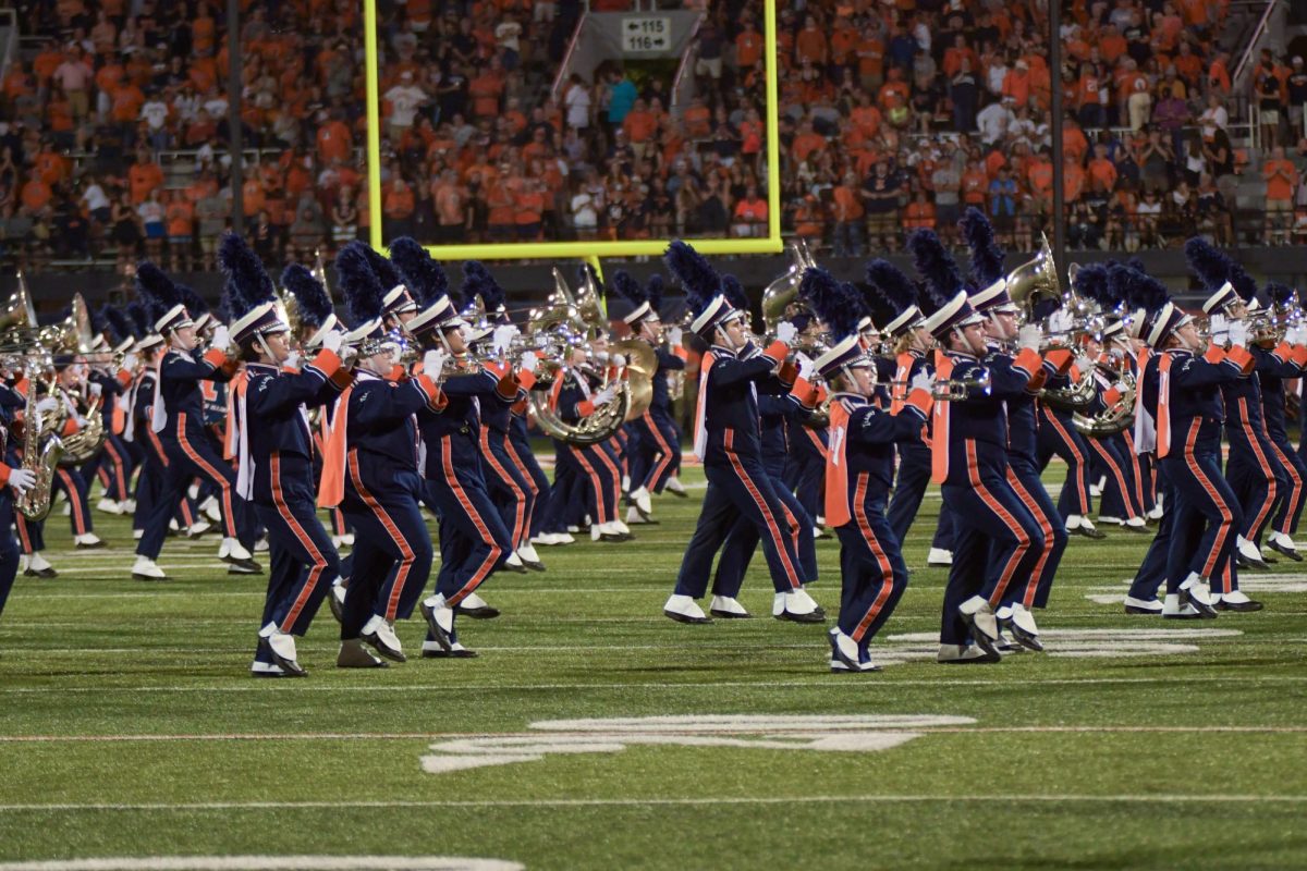 The Marching Illini perform during the halftime show at a football game against Toledo on Saturday.