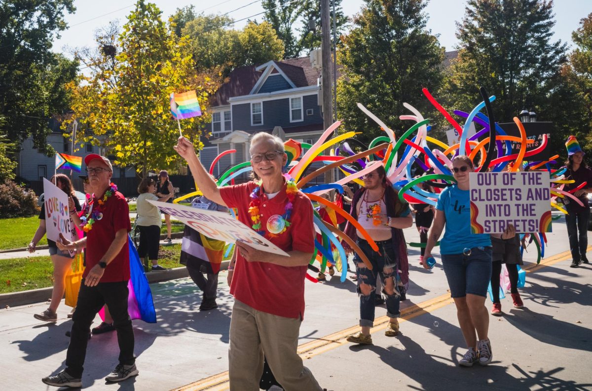 Members of the Pride Fest parade marching on W. Green Street on Sunday.