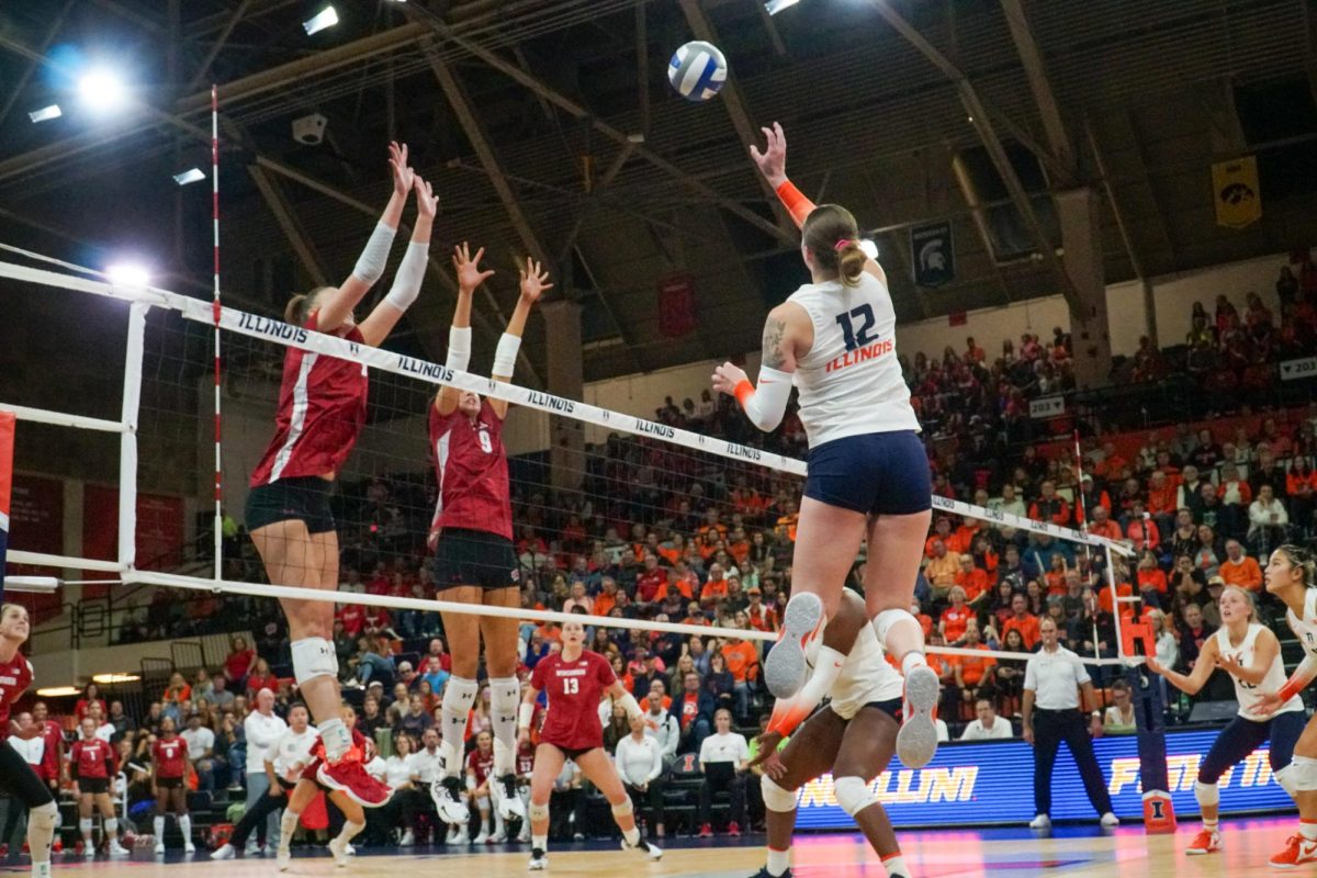 Senior+outside+hitter+Raina+Terry+leaps+to+spike+the+ball+against+Wisconsin+at+Huff+Hall+on+Oct.+7.+Terry+leads+the+Illini+with+282+kills.