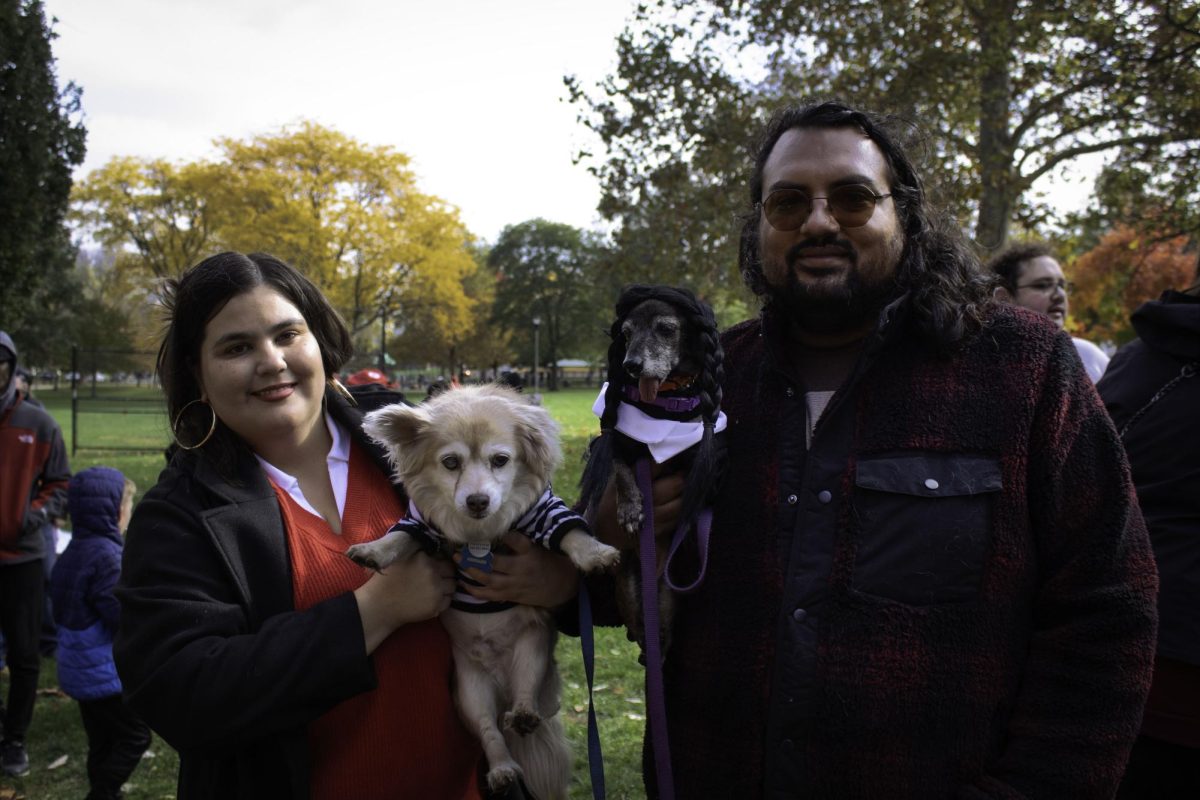 Dogs Salsa and Conrad dress up as Wednesday and Pugsley Addams with their owners during the Halloween Puppy Parade on Saturday. They were chosen by the judges and won the first place. 