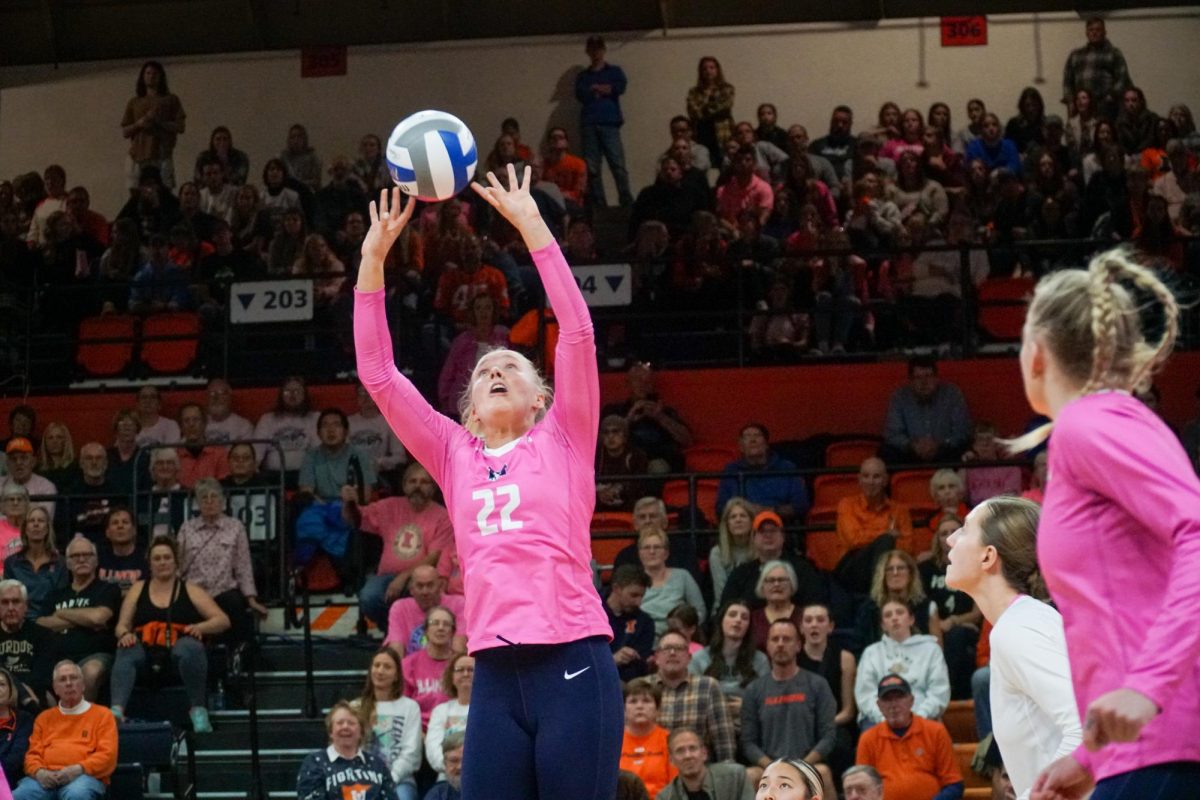 Sophomore setter Brooke Mosher sets the ball for a spike in the third set against the Purdue Boilermakers on Saturday at Huff Hall. The Illini beat the no. 16 ranked Boilermakers in four sets.