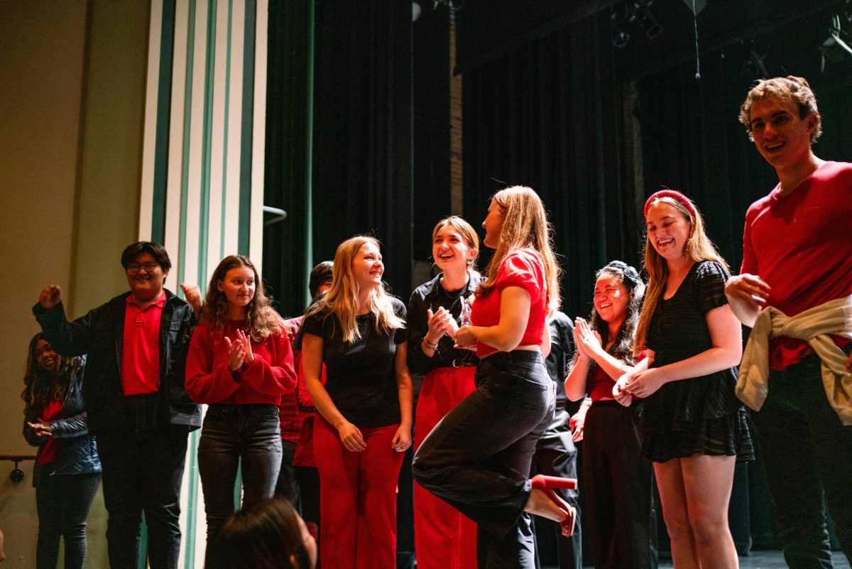 First place winners of the global talent show at Lincoln Hall Theater, Off The Record, win first place for their a cappella performance on Oct. 17.