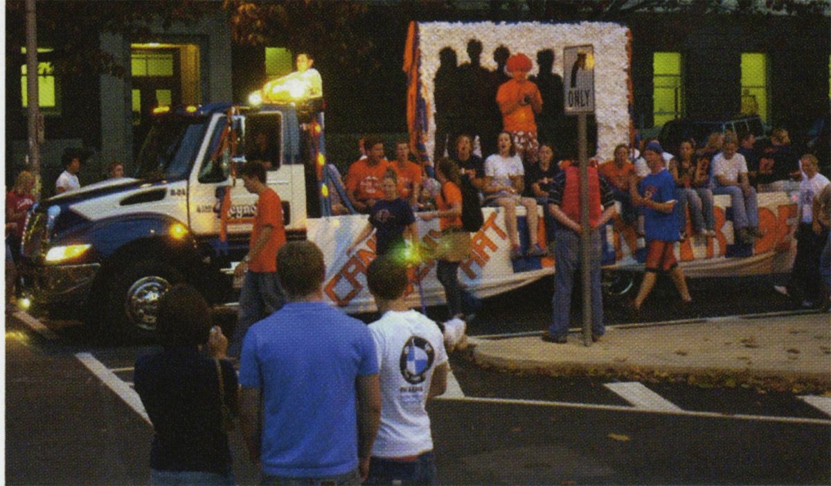 I-Pride rides in on their float during the 2006 homecoming parade.